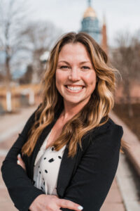 Jackie Gonzales helps potential new homebuyers with down payment assistance programs, classes, and mortgage lending opportunities. Headshot photo.